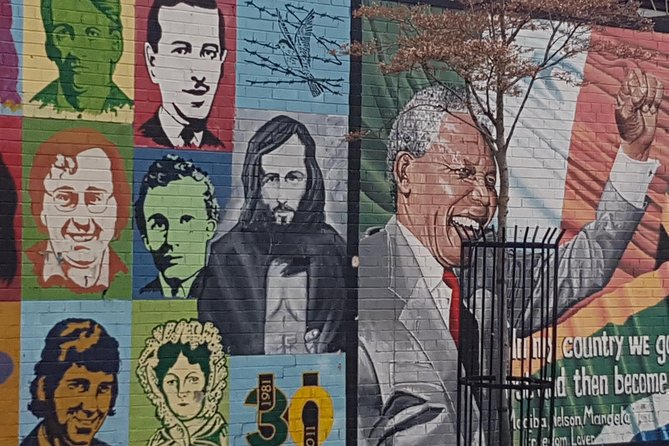 Belfast Troubles Murals Street Art and Peace Wall Walking Tour - Divis Street International Wall: Murals for Causes Around the World